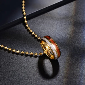 Domed tungsten carbide ring with meteorite and oak wood inlay by TMJ, showcasing a sleek, durable design with unique natural materials.