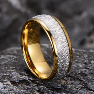 Elegant tungsten carbide ring by TMJ featuring a silver leaf meteorite inlay, showcasing a sleek, modern design.