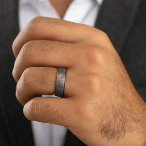 Genuine Gibeon meteorite and zirconium ring by TMJ, featuring a unique meteorite inlaid with a sleek zirconium band.