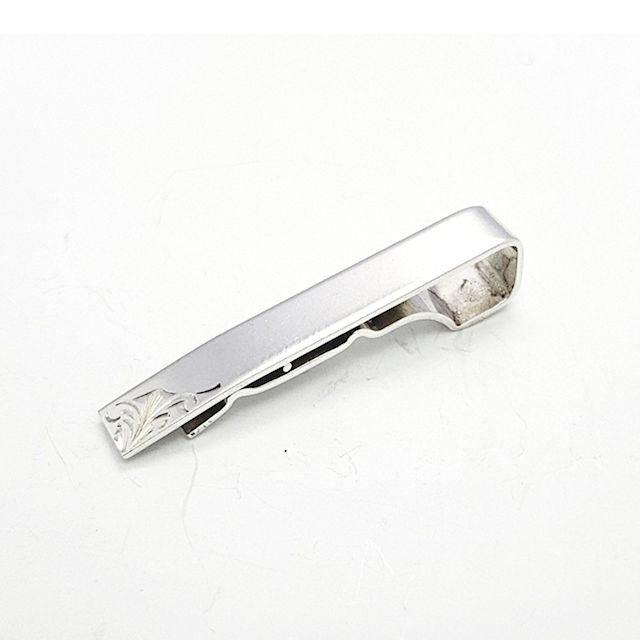 T.M.J sterling silver tie bar with subtle engraved design on white background