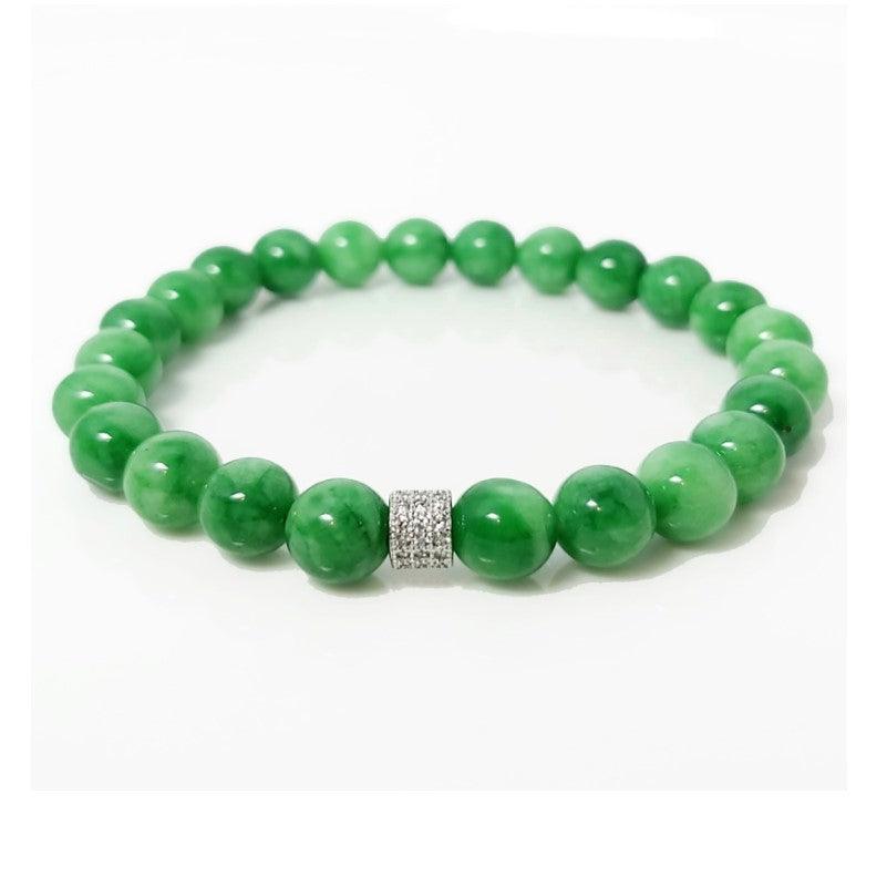 Green Jadeite beaded bracelet by T.M.J with 6mm round beads, 17cm length, showcasing smooth, polished jadeite stones.