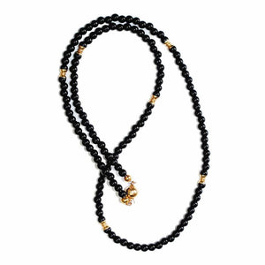 Beaded necklace featuring natural black onyx and 9k gold spacer beads, stylish jewelry by T.M.J.