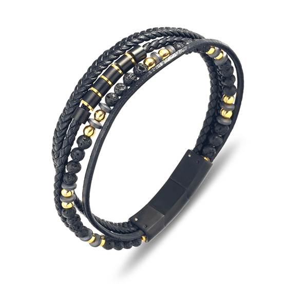 Stainless steel men's black leather bangle with lava stones and shiny gold accents, part of T.M.J's leather bracelet collection.