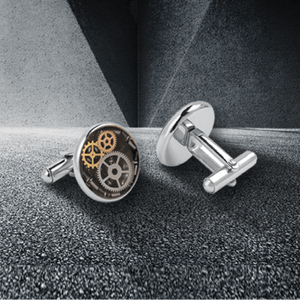 Gold-plated mechanical watch cufflinks by T.M.J featuring intricate watch face design and elegant craftsmanship.