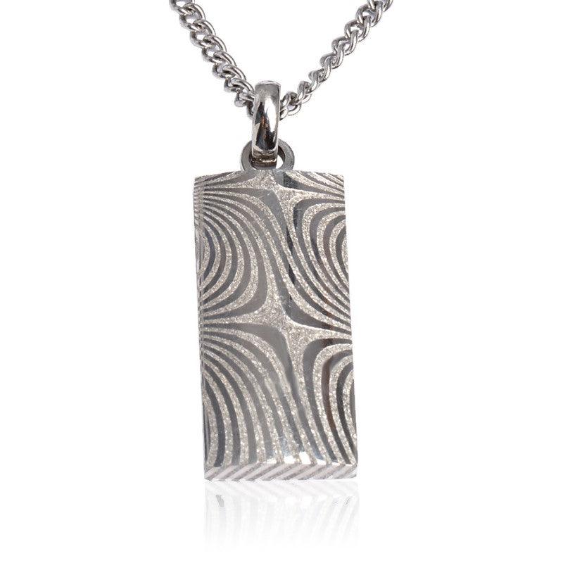 Damascus steel dog tag pendant with chain, T.M.J brand, featuring a sleek, rugged design perfect for casual wear.