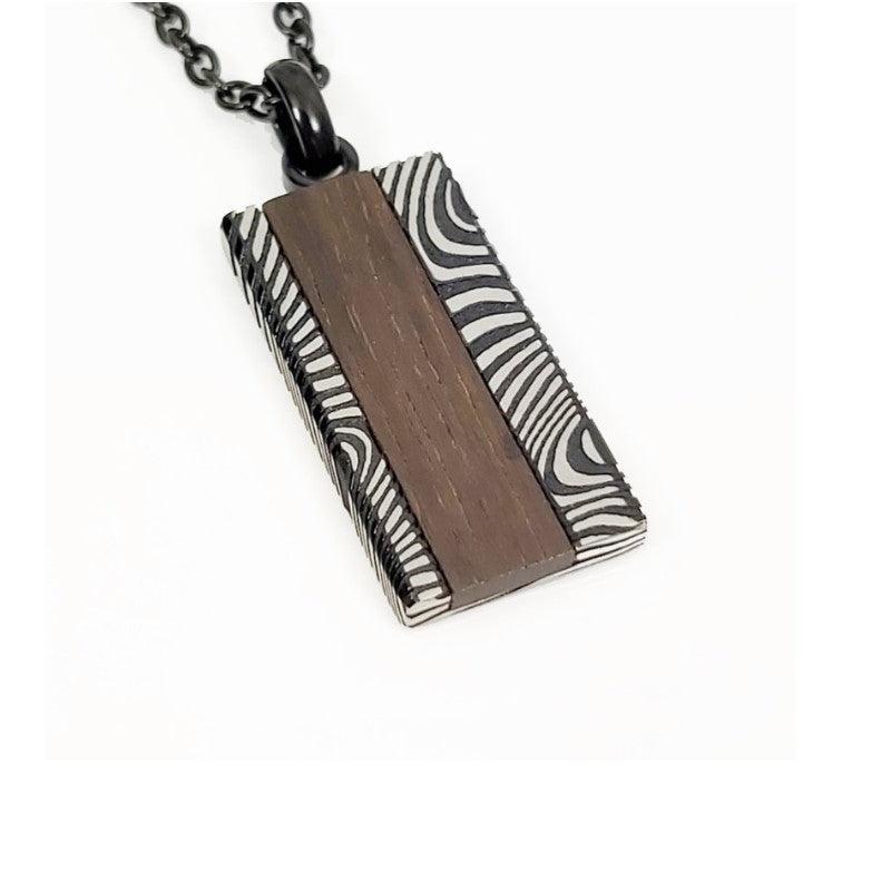 Men's Damascus stainless steel and ebony wood dog tag pendant with engraved details, stylish and durable jewelry accessory.