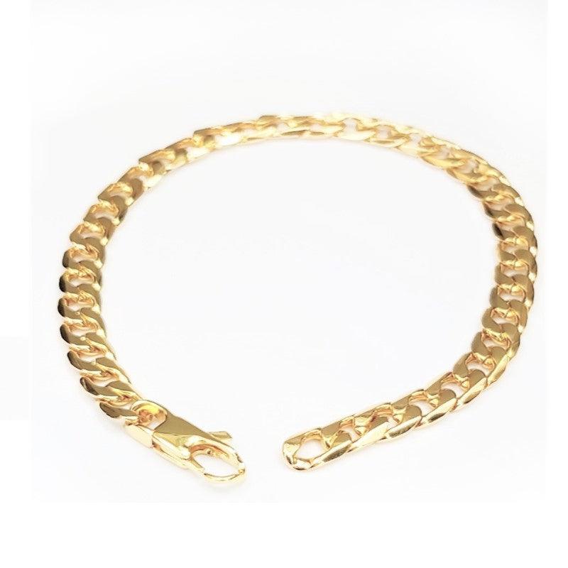 Stainless steel gold plated Cuban link bracelet by T.M.J, 19cm length, showcasing shiny, durable jewelry design.