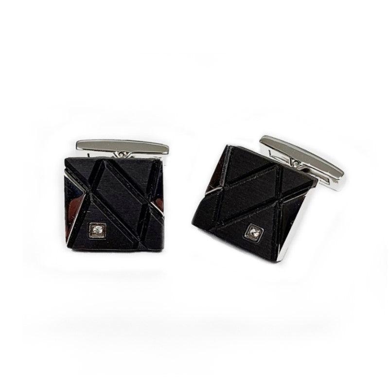 Elegant stainless steel and carbon fiber cufflinks with cubic zirconium accents, showcasing a sleek, modern design by T.M.J.