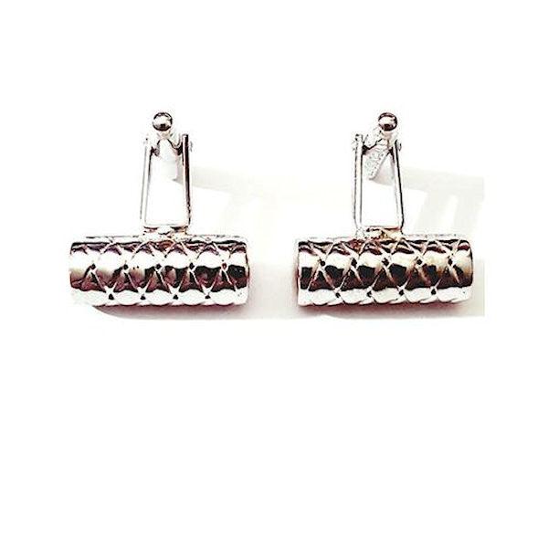 Sterling silver cylinder cufflinks by T.M.J, handcrafted with a sleek, polished silver finish for men's formal accessories.