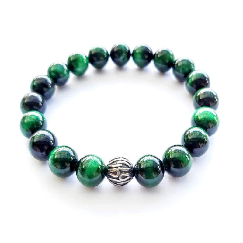 Green Tiger Eye  Bead BraceletThis 10mm Tiger Eye elasticated bead bracelet with a 10mm stainless steel spacer bead. This a true piece of art you'll be proud to own and happy to wear for any occaBead BraceletsT.M.JTheodore Men's JewelryGreen Tiger Eye Bead