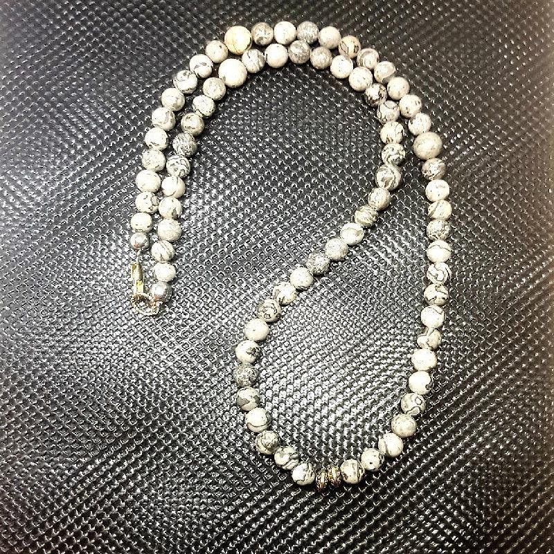 Grey Jasper  Bead NecklaceGrey Jasper Bead Necklace
This exquisite Grey Jasper Bead Necklace is crafted to provide strength, stability, and grounding, making it the perfect accessory for any Beaded NecklaceT.M.JTheodore Men's JewelryGrey Jasper Bead Necklace