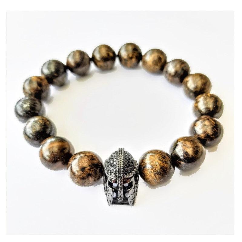 Helmet and Natural Bronzite Stone Beads BraceletDESCRIPTION
 This stone has powerful metaphysical properties that will help to shield you against negativity. The energy of these stones may stimulate the gift of prBead BraceletsT.M.JTheodore Men's JewelryHelmet and Natural Bronzite