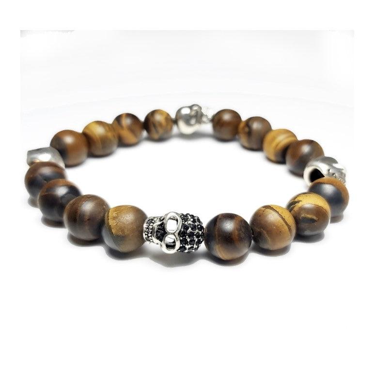 Matte Tiger Eye and 4 Skull  Bead BraceletThis 10mm Tiger Eye elasticated bead bracelet with a 10MM stainless steel skulls spacer beads. This a true piece of art you'll be proud to own and happy to wear for Bead BraceletsT.M.JTheodore Men's JewelryMatte Tiger Eye