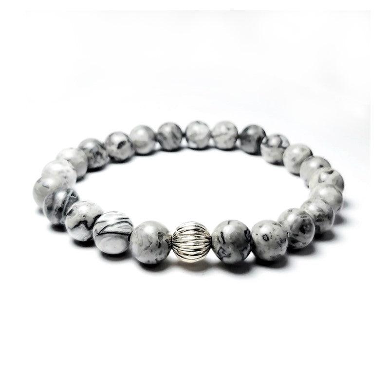 Natural Gray Jasper Beads BraceletDESCRIPTION
 Traditionally it is used to bring serenity and unity. They say this type of Jasper is a supreme protector. It reminds us to help each other. Placed undeBead BraceletsT.M.JTheodore Men's JewelryNatural Gray Jasper